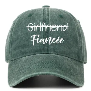 Close-up of embroidered Fiancée text on a vintage washed green cotton baseball cap.