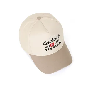 Detailed view showing the Cowboys and Tequila embroidery on a two-tone trucker cap