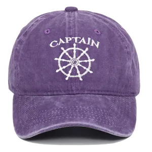 Front view of purple washed cotton baseball cap with white CAPTAIN embroidery and ship wheel