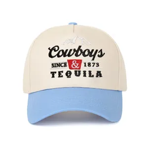 Close-up of Cowboys and Tequila embroidery on a cream and light blue color-block cap