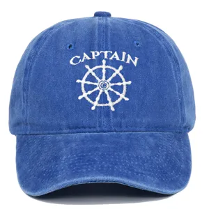 Detailed view of a blue washed cotton baseball cap with Captain embroidery design