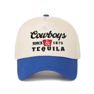 Detailed embroidery of Cowboys and Tequila on a two-tone cream and blue baseball cap.