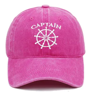 Vintage washed pink baseball cap with white Captain and ship wheel embroidery detail