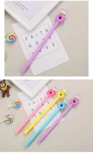 Creative donut and unicorn topped gel pens in pink, yellow, blue, and purple colors.