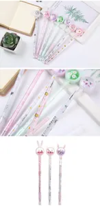 Macro detail of cute animal sequin gel pens featuring rabbit and cat themed toppers