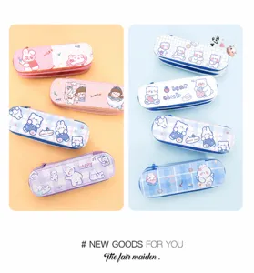 Detail view of assorted cute cartoon canvas pencil cases in pastel pink and blue
