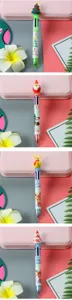 Detailed view of four multi-color Christmas pens with festive toppers and patterns