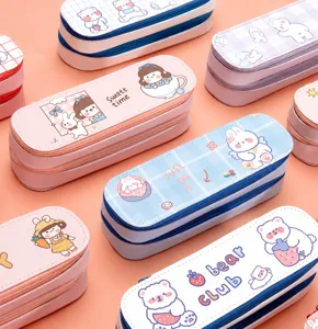 Close-up of cute cartoon double-layer canvas pencil cases in pastel colors