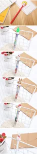 Collection of festive Christmas pens featuring Santa, reindeer, and tree designs