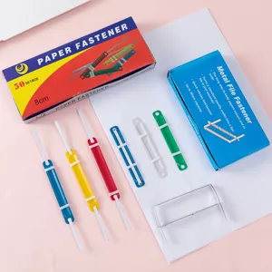 Colorful plastic and metal paper fasteners for office file organization and document binding.