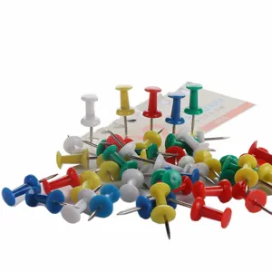 Colorful plastic push pins detail view, mixed multi-color thumb tacks for bulletin board.
