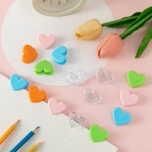Colorful heart-shaped plastic mini clips detail view, perfect for cute photos and notes decor.