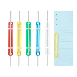 Colorful plastic loose-leaf binding clips detail shot for office document organization.