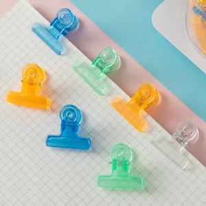 Transparent colorful binder clips, mini plastic paper clamps for school stationery organizers.