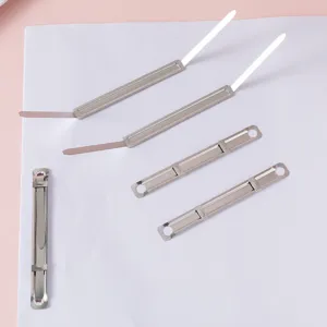 Close-up detail view of durable metal file fasteners and prong clips for office paper binding.