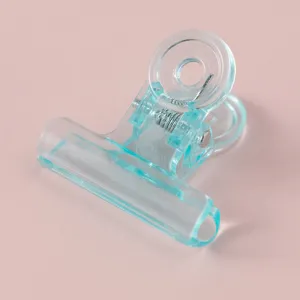 Transparent acrylic binder clip cute ice-blue office stationery paper clamp aesthetic desk accessory.