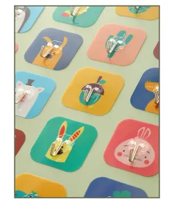 Detailed view of various cute cartoon self-adhesive wall hooks in multiple colors