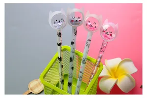 Set of four cute cartoon cat gel pens with colorful sequins in a green desk organizer