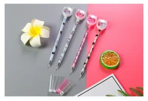 Group shot of four cute cartoon cat gel pens with colorful glitter sequins inside tops
