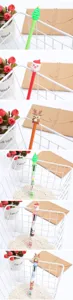 Detailed view of Christmas-themed pens with Santa and reindeer silicone toppers