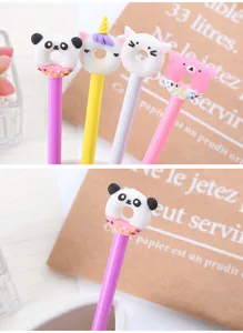 Detailed macro view of a cute panda donut shaped silicone topper on a purple gel pen