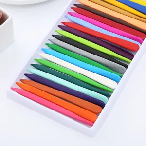 Colorful set of 18 triangular washable plastic crayons stored in a white plastic tray
