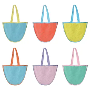 Close-up of colorful mesh beach tote bag color variants showing breathable net fabric design.