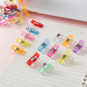 Colorful transparent sewing clips, plastic quilt binding clips for DIY crafts and office organization.