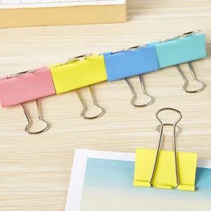Colorful metal binder clips set for office and school paper organization and document sorting.