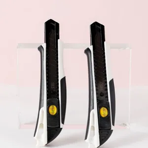 SK5 utility knife with black white handle and safety lock for precise cutting paper cardboard.