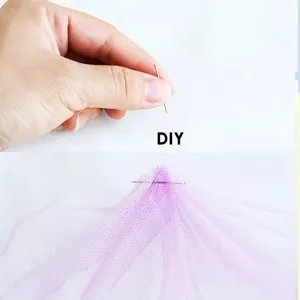 Detailed view of silver sewing pins and purple mesh fabric for DIY craft and multi-layer positioning.