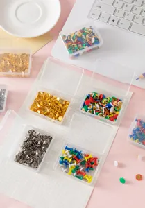 Colorful metal pushpins thumb tacks in clear storage boxes, ideal for office and home decor.