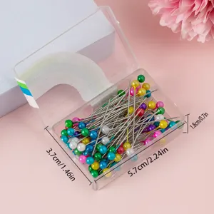 Color plastic boxed pearl head dressmaker pins with clear storage box for sewing and craft use.