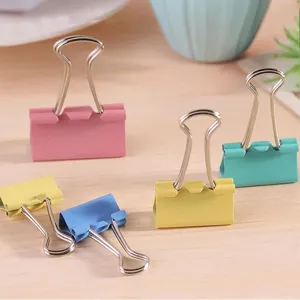Colorful metal binder clips for office stationery document organization and paper binding.