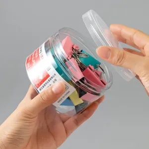 Clips de papel de colores en tarro transparente, pinzas metálicas para oficina y escuela.