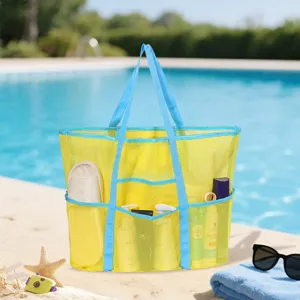 Borsa da spiaggia in rete gialla con manici blu, tasche multiple per giocattoli da piscina e viaggi.