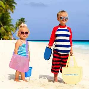 Kids beach sand removal mitt and mesh bag set for outdoor summer swimming and beach fun.