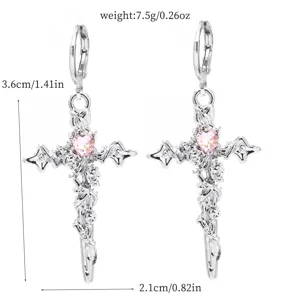 Silver cross earrings with pink heart crystal and rose motif, gothic Y2K style aesthetic jewelry.