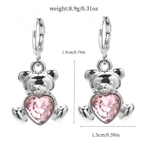 Detailed view of the cute pink heart crystal bear earrings, showing precise size and weight.