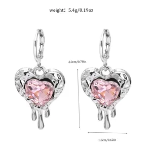 Detailed view of silver-toned pink crystal heart earrings with dimension and weight specs.