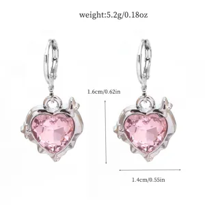 Detailed view of sweet pink heart crystal alloy earrings with cross butterfly design and size specs.
