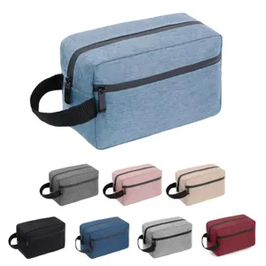 Detailed view showing multi-color oxford fabric travel toiletry bag with side handle.