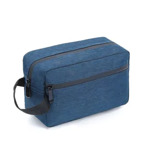 Detail view of the blue travel toiletry bag showcasing the double zipper design.