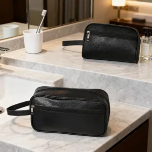 Black PU leather toiletry bag for men, waterproof travel makeup pouch with handle and zipper.