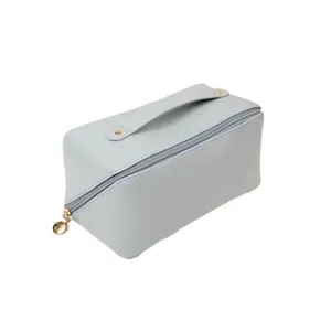 Light blue PU leather cosmetic bag portable makeup storage toiletry bag with handle zipper.