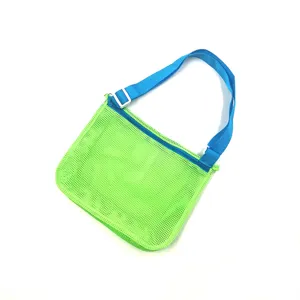 Green mesh beach bag detail, lightweight see-through toy storage shoulder bag for kids travel.