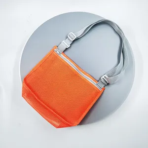 Orange mesh beach shoulder bag for kids toy storage, breathable travel tote detail view.