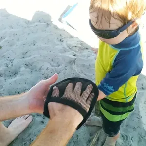 Kids beach sand removal mitt detail view, black mesh glove for easy sand cleaning.