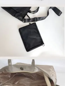 Detailansicht der grossen tragbaren Reisetasche mit praktischer Netztasche und Reissverschluss.