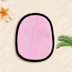 Beach sand removal mitt for kids and pets, pink exfoliating bath towel with black binding.